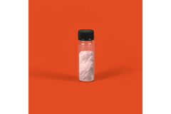 A bottle of pink powder with an orange background.
